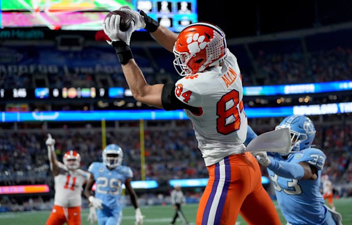 Dec 3, 2022; Charlotte, North Carolina, USA; Clemson Tigers tight end Davis Allen (84) catches a touchdown in front of North Carolina Tar Heels linebacker Cedric Gray (33) during the first quarter of the ACC Championship game at Bank of America Stadium. Mandatory Credit: Bob Donnan-USA TODAY Sports